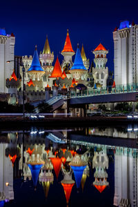 Illuminated buildings in city at night
