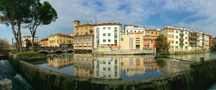 View of canal along buildings