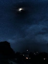 Low angle view of moon in sky at night