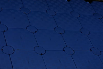 Full frame shot of tiled floor against blue sky