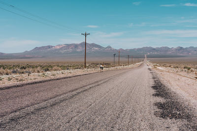 Empty road amidst landscape