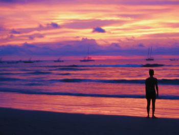 Silhouette of man standing on beach