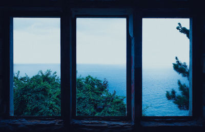 Scenic view of sea seen through window