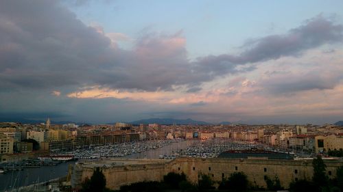 High angle shot of townscape against sky at sunset