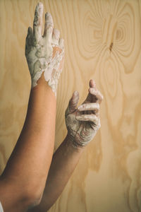 Low section of woman legs on wall