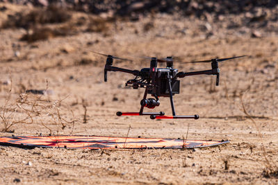 Drone hovering over land