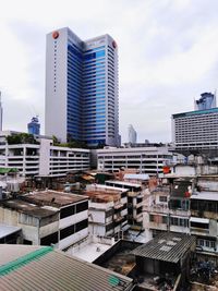 Modern buildings in city against sky