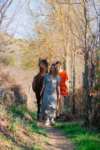 People standing in forest during autumn