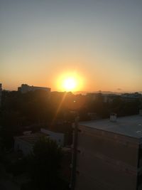 High angle view of buildings against sky during sunset