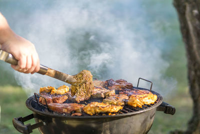 Close-up of meat cooking on barbecue grill