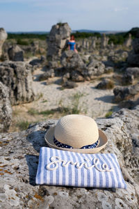 Rear view of hat on rock