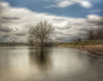 Scenic view of landscape against cloudy sky