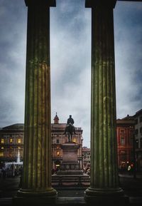 Low angle view of historical building against cloudy sky