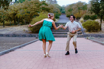 Full length of a smiling young couple