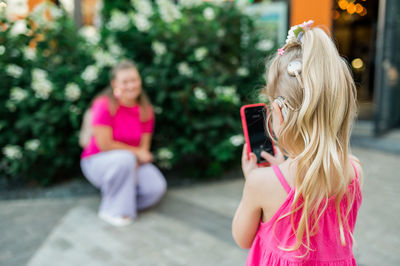 Young woman using mobile phone