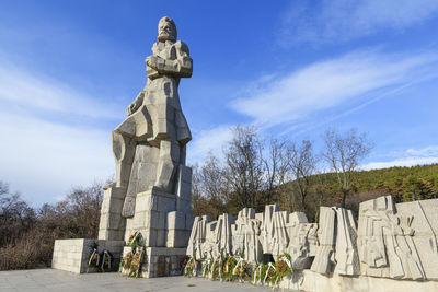 Low angle view of statue against sky