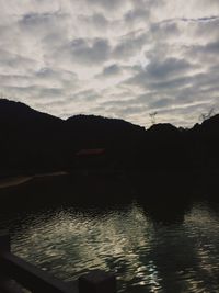 Scenic view of silhouette mountains against sky at sunset