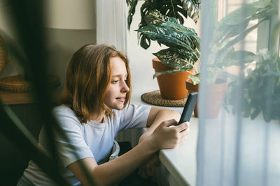 The girl communicates with friends in social networks and instant messengers.