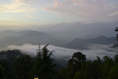 Scenic view of mountains against sky during sunset