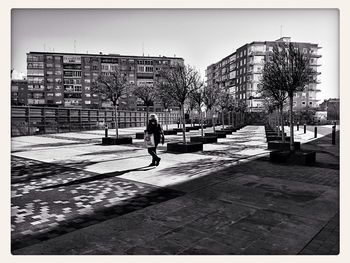 Woman walking on city street