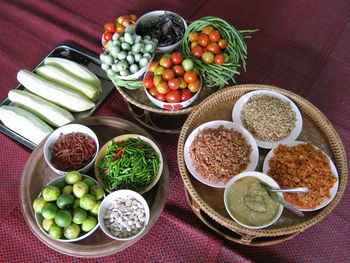 High angle view of vegetables and ingredients on table