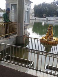 Reflection of sculpture on railing