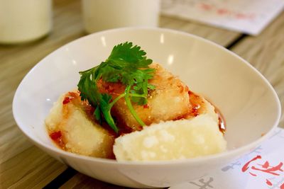 Close-up of tofu served in bowl on table