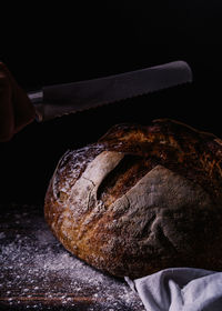 Close-up of person preparing food on table