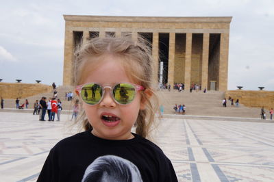 Girl wearing sunglasses against ataturk mausoleum