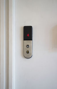 Close-up of elevator controller button on wall