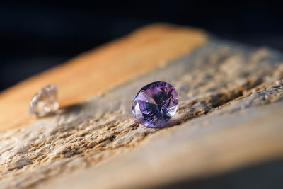 Close-up of wedding rings on rock