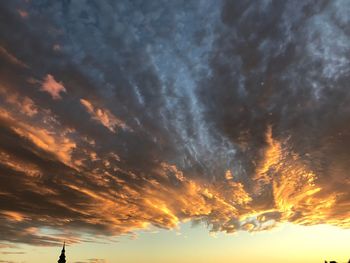 Low angle view of dramatic sky during sunset