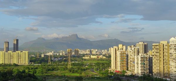 Buildings in city against sky