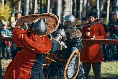 Rear view of people in traditional clothing