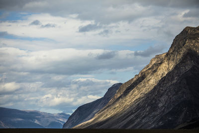 Sunlight shines on baffin island mountains in auyuittuq national park