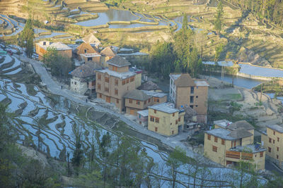 High angle view of townscape and trees in town