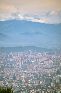 High angle view of city buildings against sky