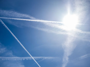 Low angle view of vapor trails in sky