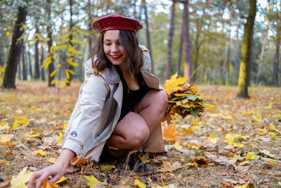 Young woman sitting on field