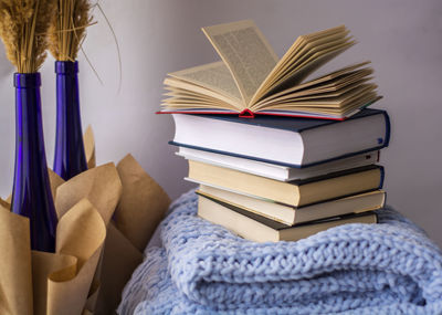 Close-up of books on table at home