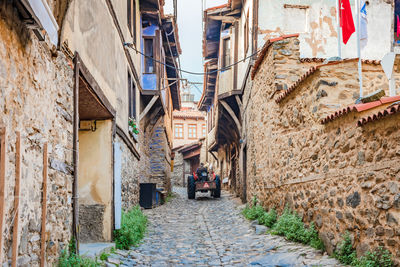 Narrow alley amidst buildings in city