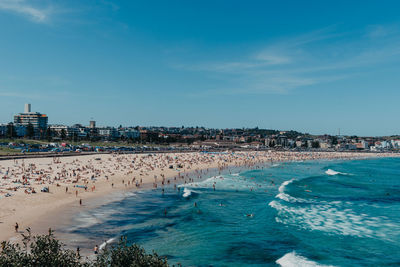 High angle view of sea and buildings against sky