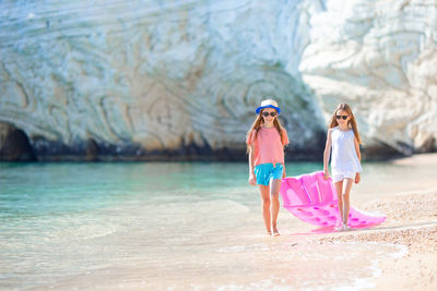 Women standing on beach