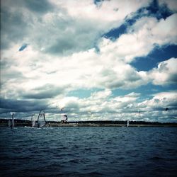 Scenic view of sea against cloudy sky