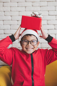 Portrait of happy boy wearing red hat