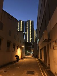 Street amidst buildings against sky in city