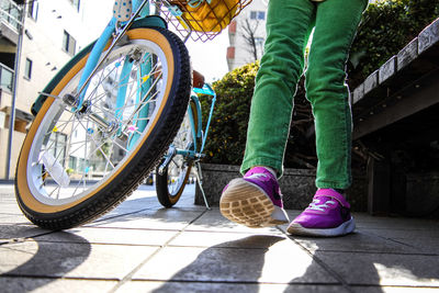 Low section of man cycling bicycle