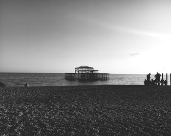 People on beach against sky