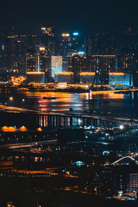 High angle view of illuminated buildings in city at night