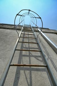 Low angle view of ladder against sky